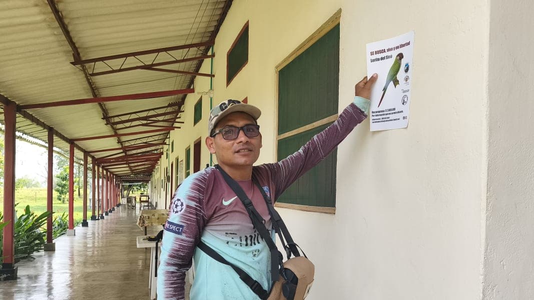 Luis Carlos Martinez with one of the team's posters (photo by Eduar Paez)